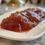 Golden homemade nectarine jam spread on toast