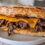 slow cooker beef and cheddar sandwich
