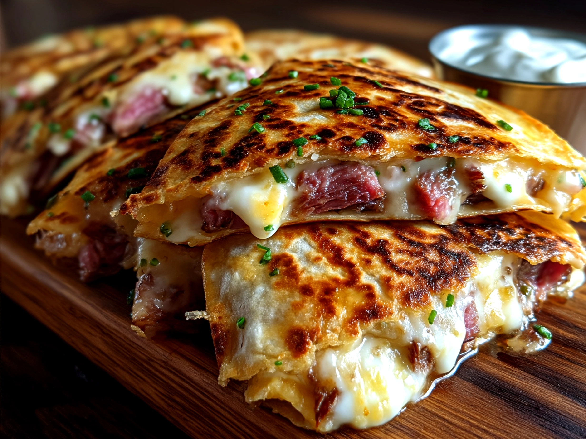 Golden crispy Corned Beef Quesadillas served with salsa and sour cream